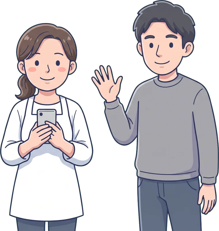 店主と担当者が並んで、こちらを向いて立っている
